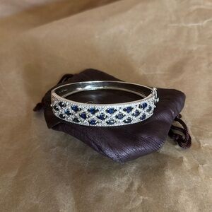 Sterling Silver bangle, sapphires, with minor wear.